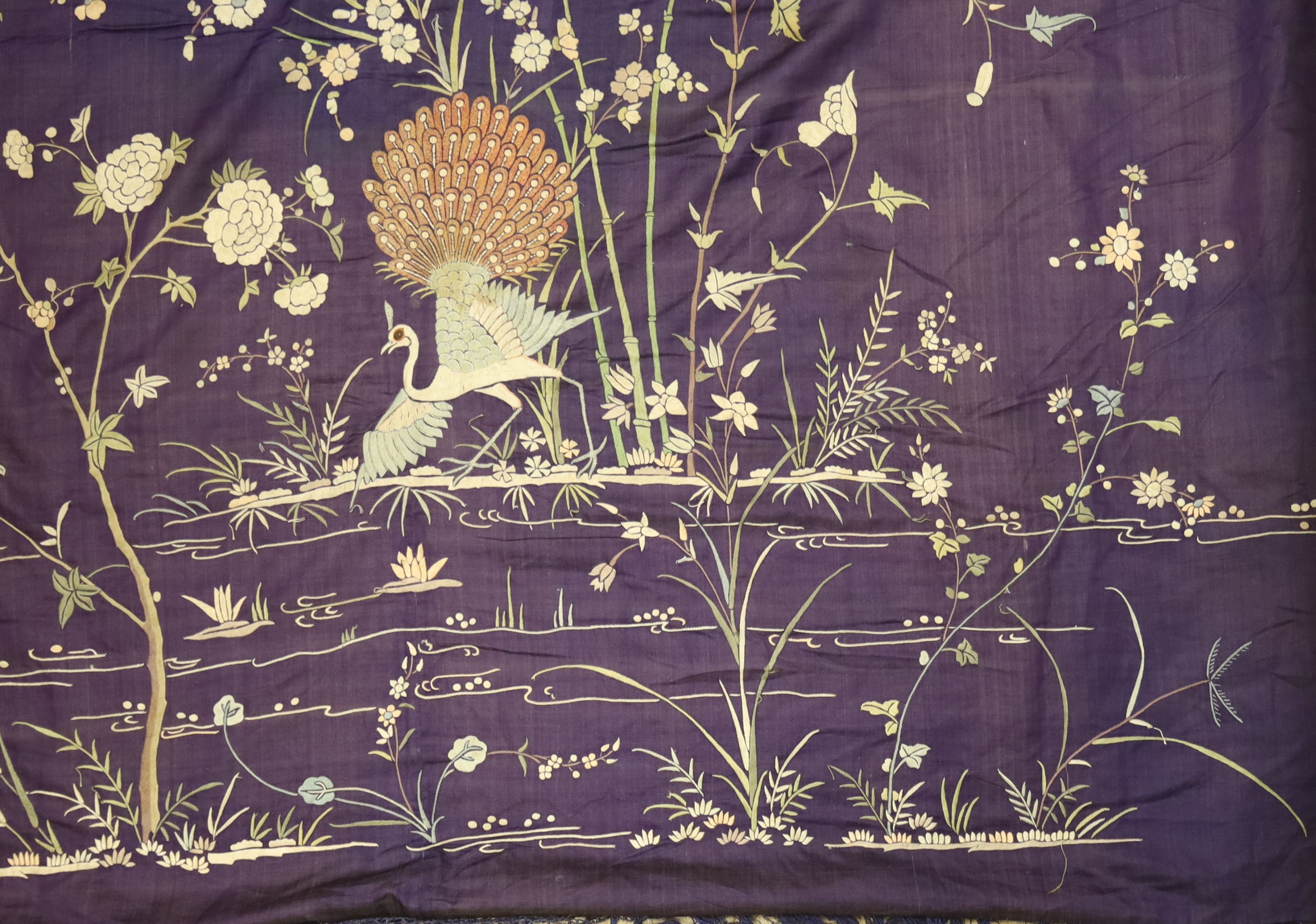 An early 20th century Chinese purple silk embroidered throw edged with trimming, 130 x 134cm